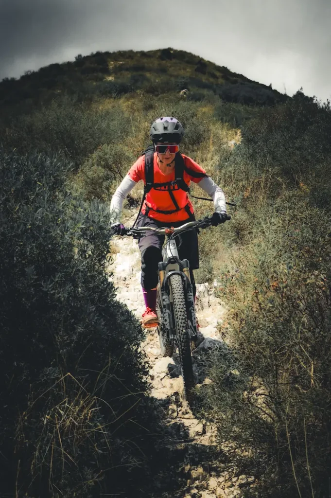 Professional MTB guide riding a technical trail in Finale Ligure - Trails Unlimited