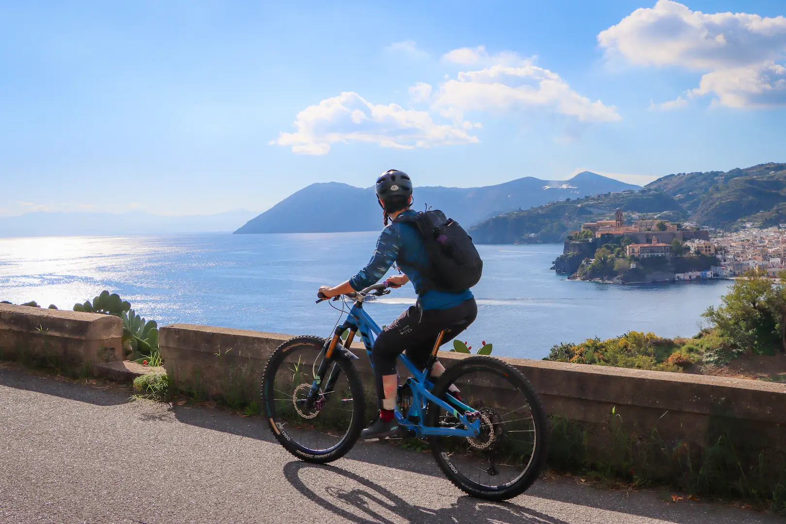 Coastline MTB riding in Lipari with a panoramic view of the Aeolian Islands during the Riding into the Lava volcano tour.