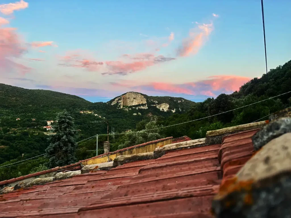 Evening view from Boragni village overlooking the limestone cliffs of Finale Ligure.